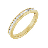 1/4 ctw channel-set round brilliant cut diamond band in 14K yellow gold, 2.6 mm width, angle view
