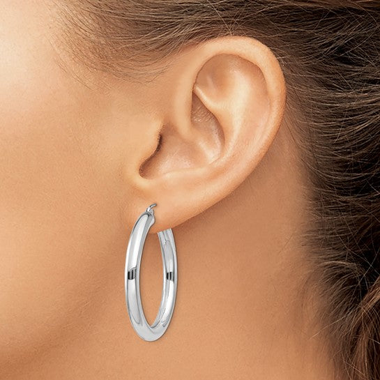 35 mm bold hoop earrings in solid 14K white gold shown on ear